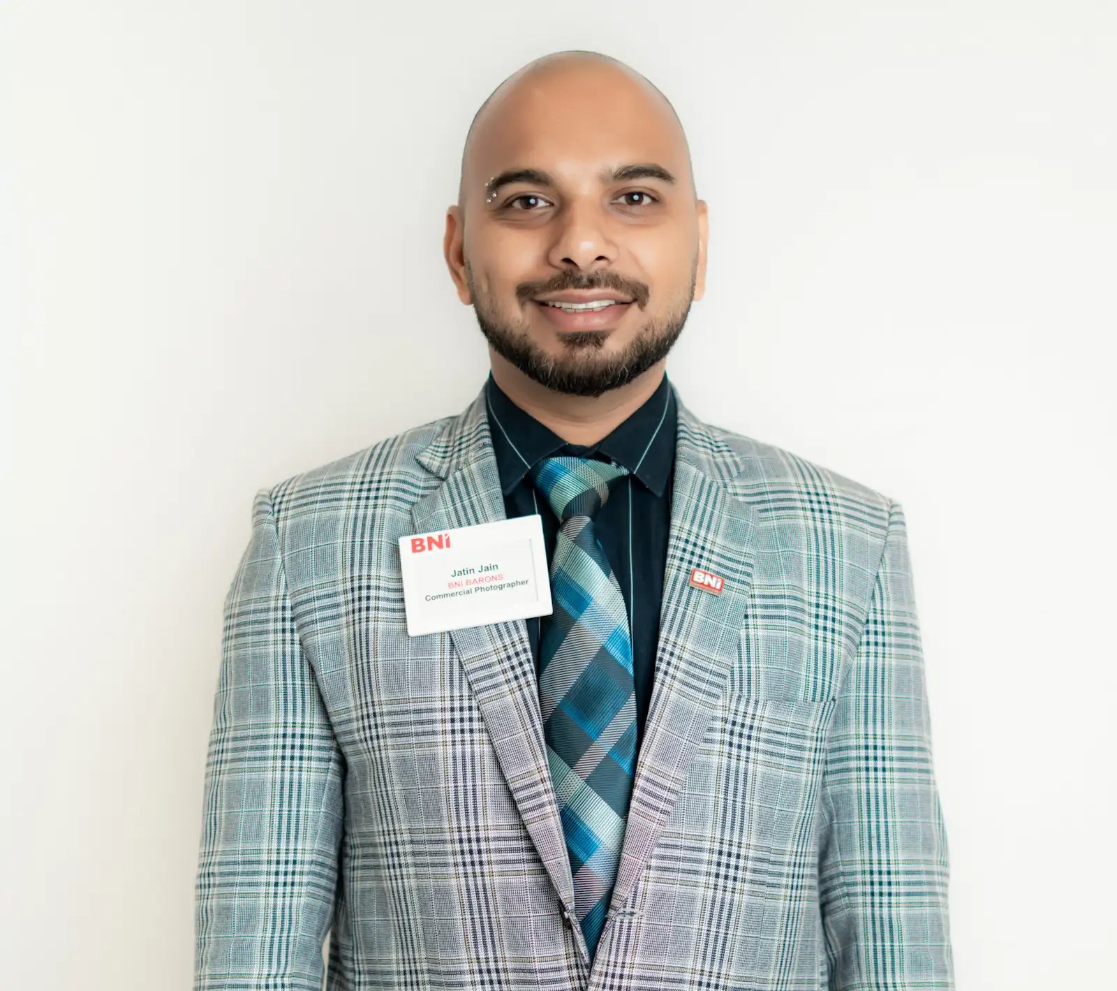 Jatin Jain, photographer and mentor, in a checked blazer