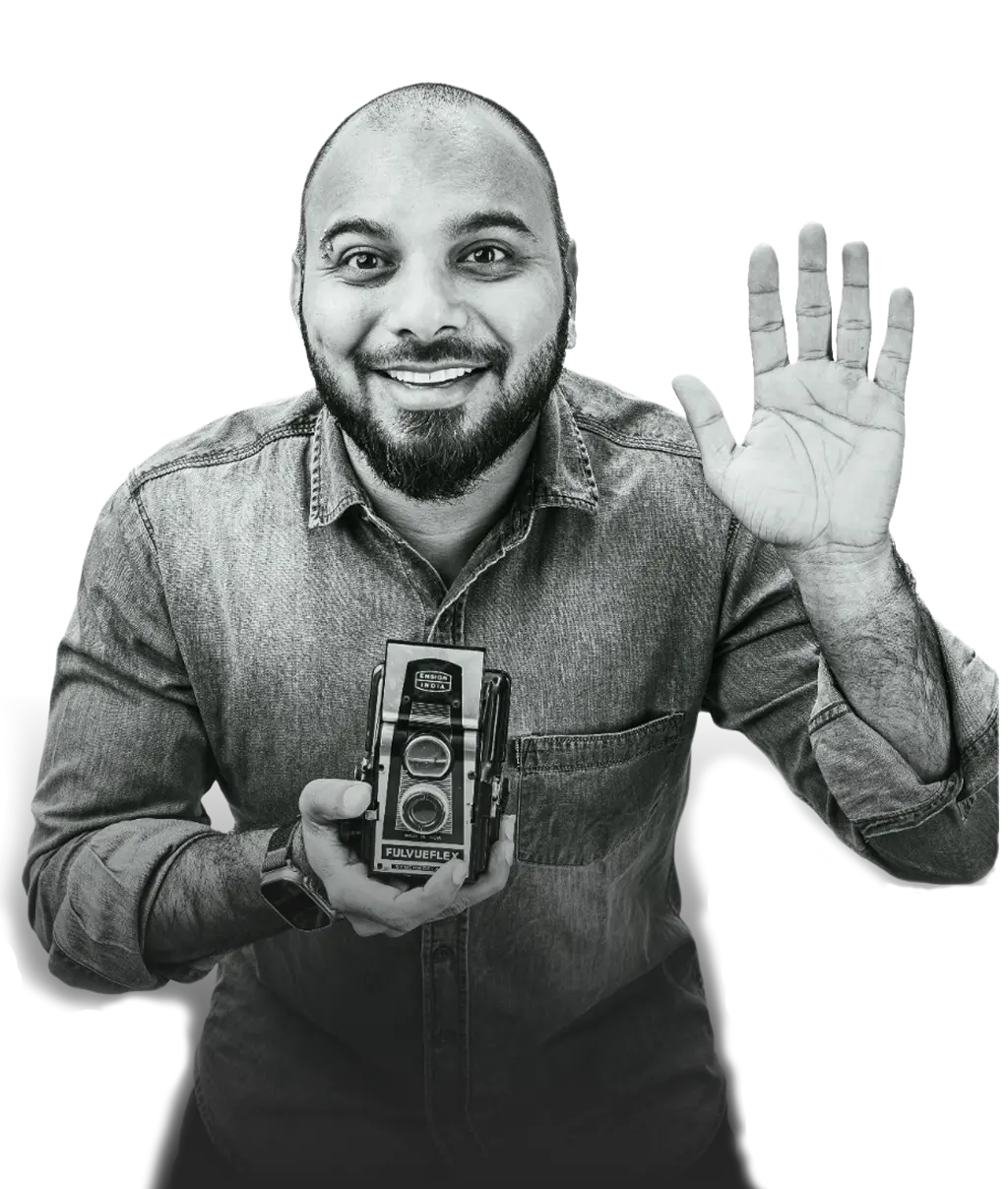 Jatin Jain holding a camera and waving (placeholder)